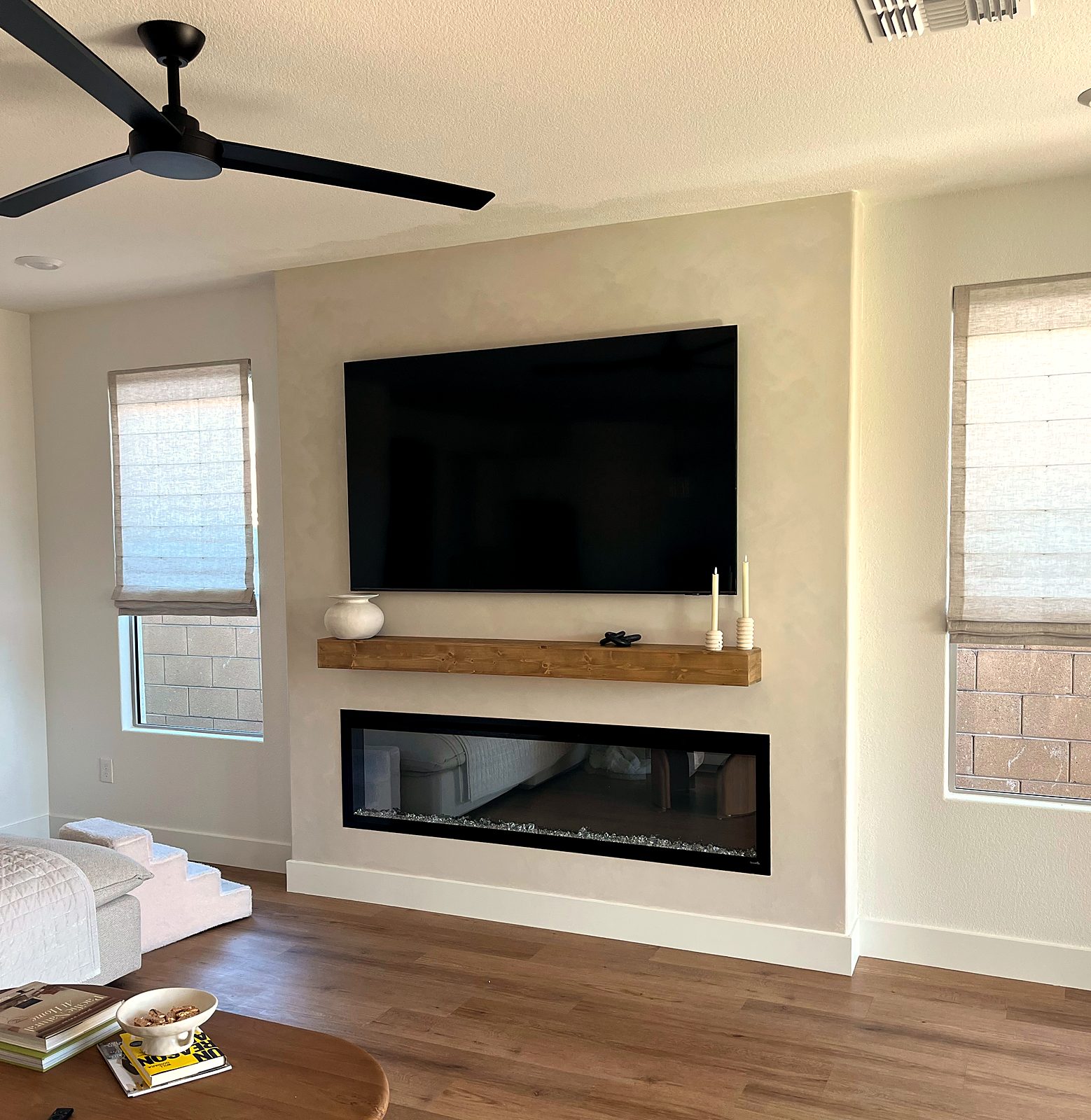 Fireplace wall with wood mantel